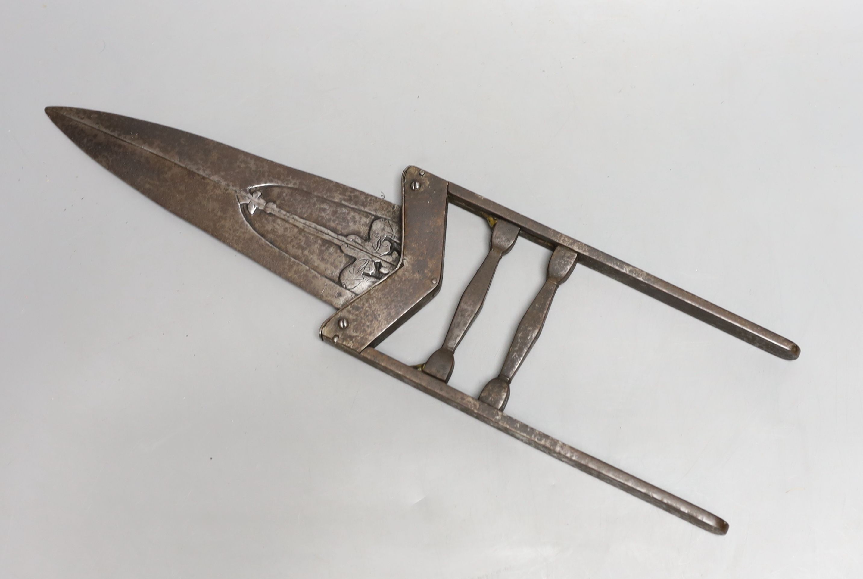 An Indian 19th century ‘scissors katar’, blades chiselled with elephant heads open to reveal an inner blade when grip is squeezed, overall length 40cms